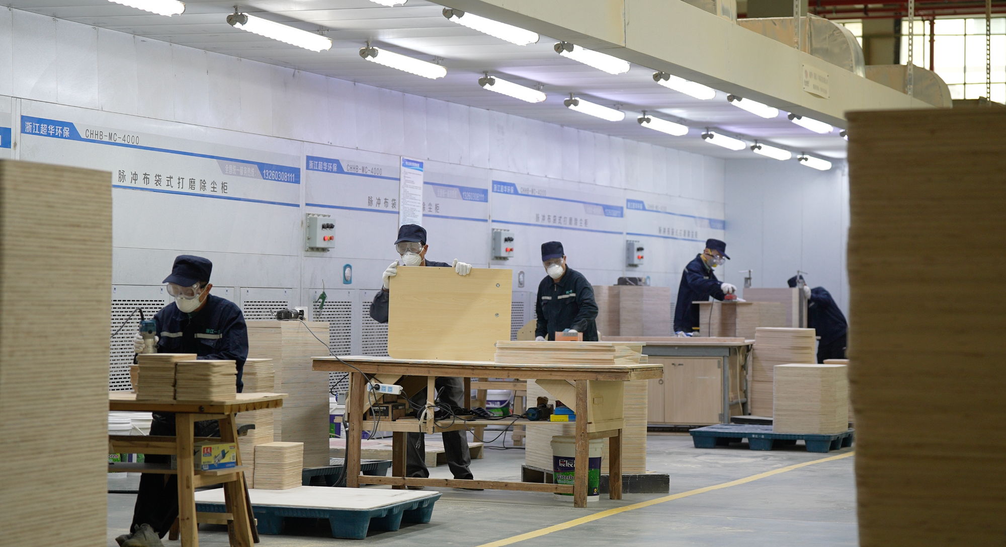 Workers assembling studio Pilates apparatus on the factory floor in Zhejiang, China